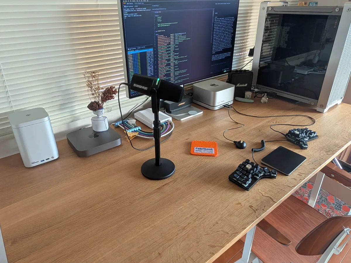Local development environment — Mac Studio, Shure mic, Claw44, compute server